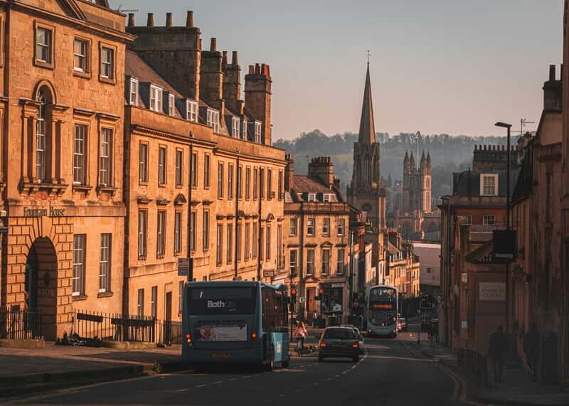An image of a street lined with buildings that have older architecture and more character.